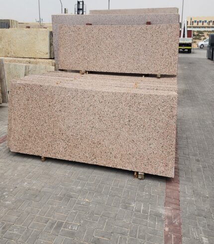 rosy pink granite slab at store
